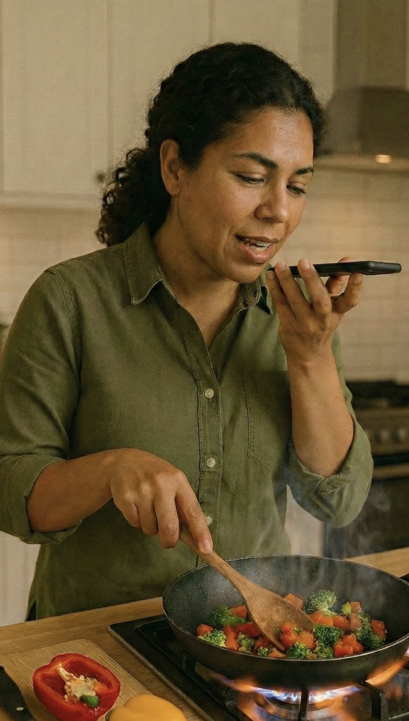 Woman voice logging a meal while cooking